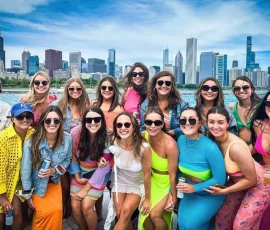 Group photo on a Chicago boat rental with the Chicago skyline in the background.